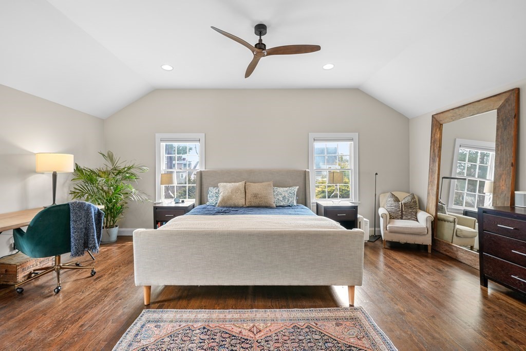 19 Elmwood Road Wellesley, MA 02481 - Photo 26 of 41 a bedroom with a bed a couch and potted plant with wooden floor