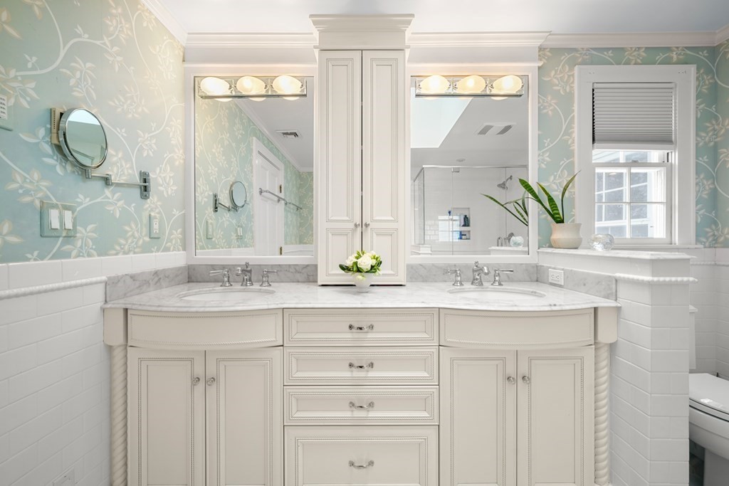 19 Elmwood Road Wellesley, MA 02481 - Photo 27 of 41 a bathroom with a granite countertop sink vanity and mirror