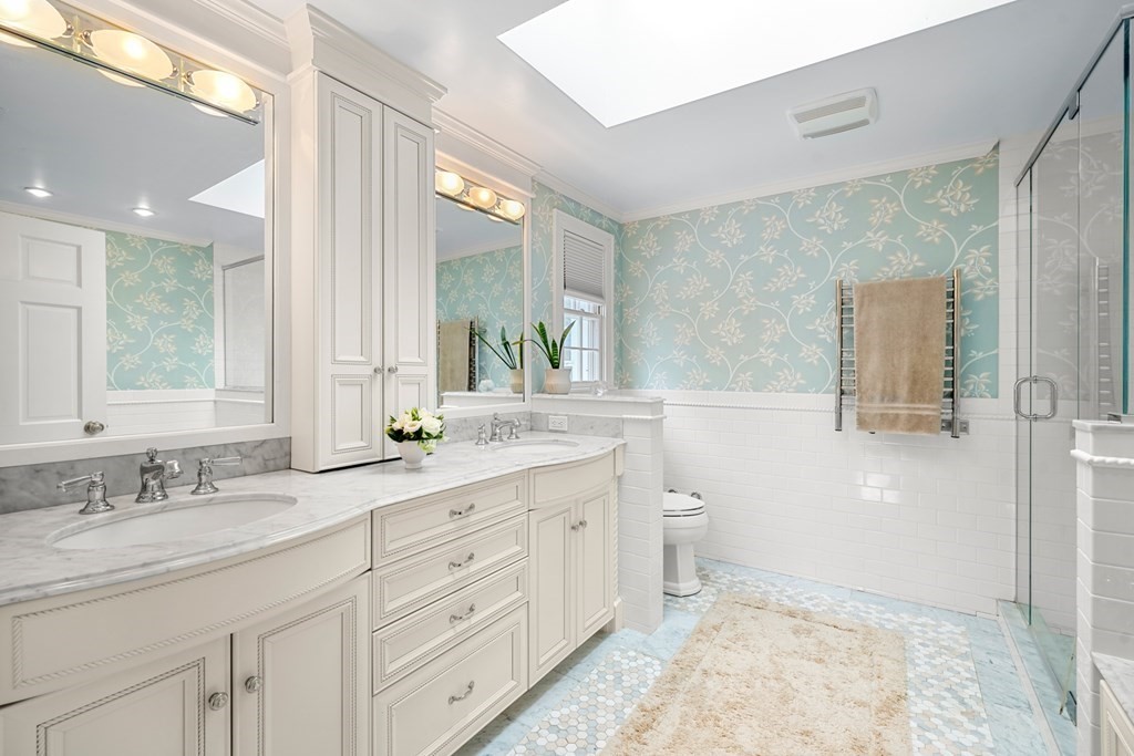 19 Elmwood Road Wellesley, MA 02481 - Photo 28 of 41 a bathroom with a granite countertop sink a toilet and a mirror