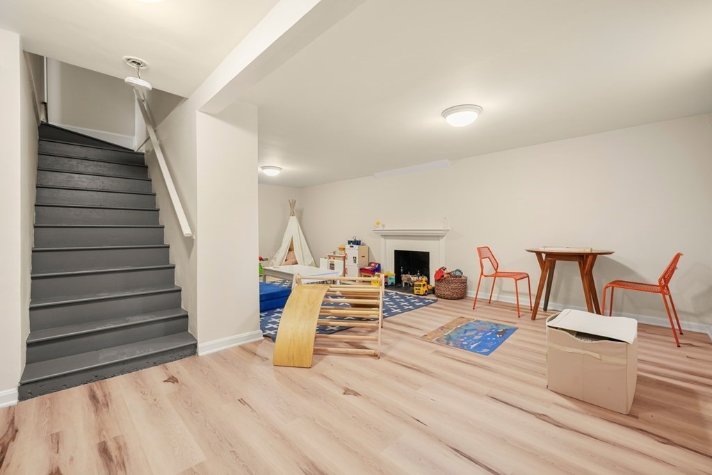 19 Elmwood Road Wellesley, MA 02481 - Photo 33 of 41 a bedroom with furniture and wooden floor