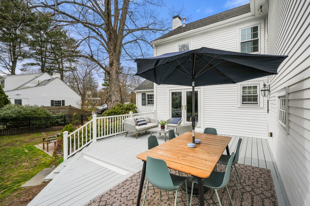 19 Elmwood Road Wellesley, MA 02481 - Photo 36 of 41 a roof deck with a table and chairs