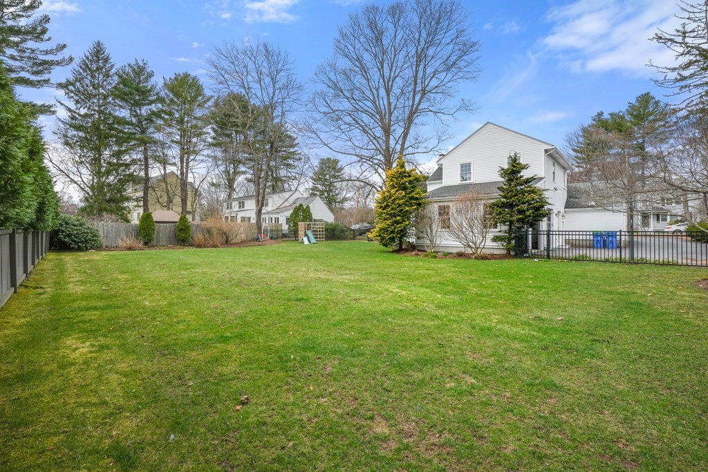 19 Elmwood Road Wellesley, MA 02481 - Photo 39 of 41 a view of a house with a big yard and large trees