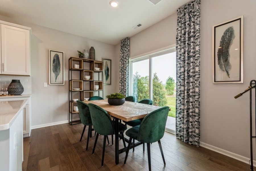 1238 Draper Road McHenry, IL 60050 - Photo 6 of 14 a view of a dining room with furniture window and wooden floor