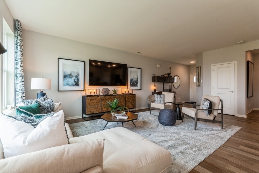 1238 Draper Road McHenry, IL 60050 - Photo 9 of 14 a living room with furniture and a flat screen tv