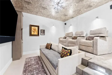 a living room with furniture and a lamp