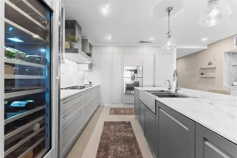 a bedroom with a large bed and a large window