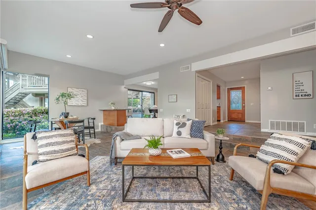 a living room with furniture and a rug