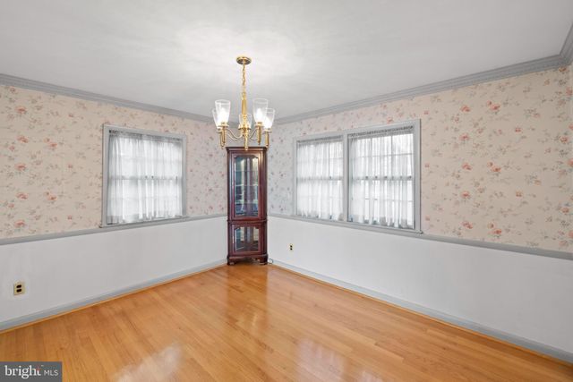 a kitchen with stainless steel appliances a refrigerator and a stove