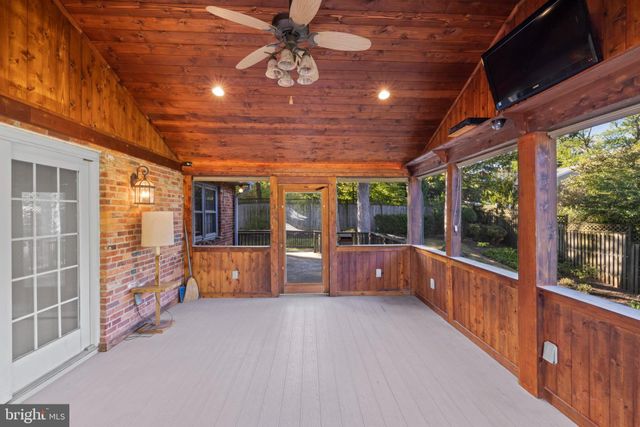 a view of an empty room with windows