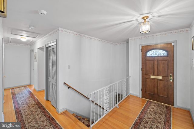 a living room with furniture rug and window