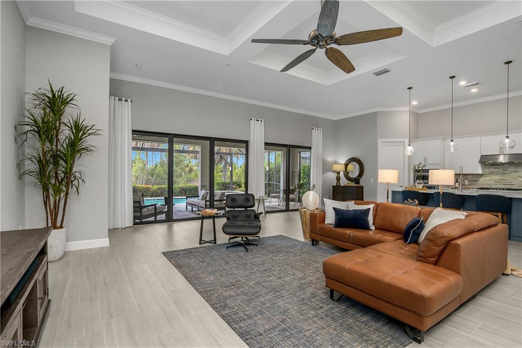 19040 Marquesa Drive Fort Myers, FL 33913 - Photo 11 of 50 Enjoy seamless indoor/outdoor living with a wall of glass sliders allowing for plenty of natural light and giving you even more daily living space with the opportunity to utilize the outdoor space.