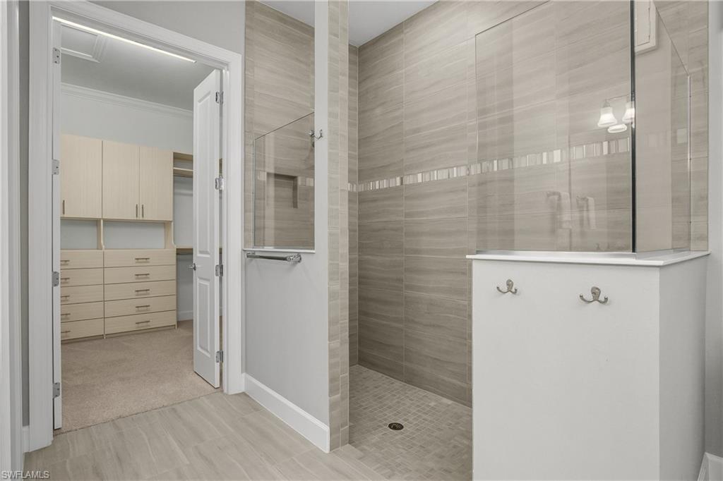 19040 Marquesa Drive Fort Myers, FL 33913 - Photo 20 of 50 Custom floor to ceiling tile in walk-in shower.