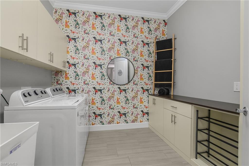 19040 Marquesa Drive Fort Myers, FL 33913 - Photo 27 of 50 HUGE laundry room with additional built in cabinetry and utility sink.