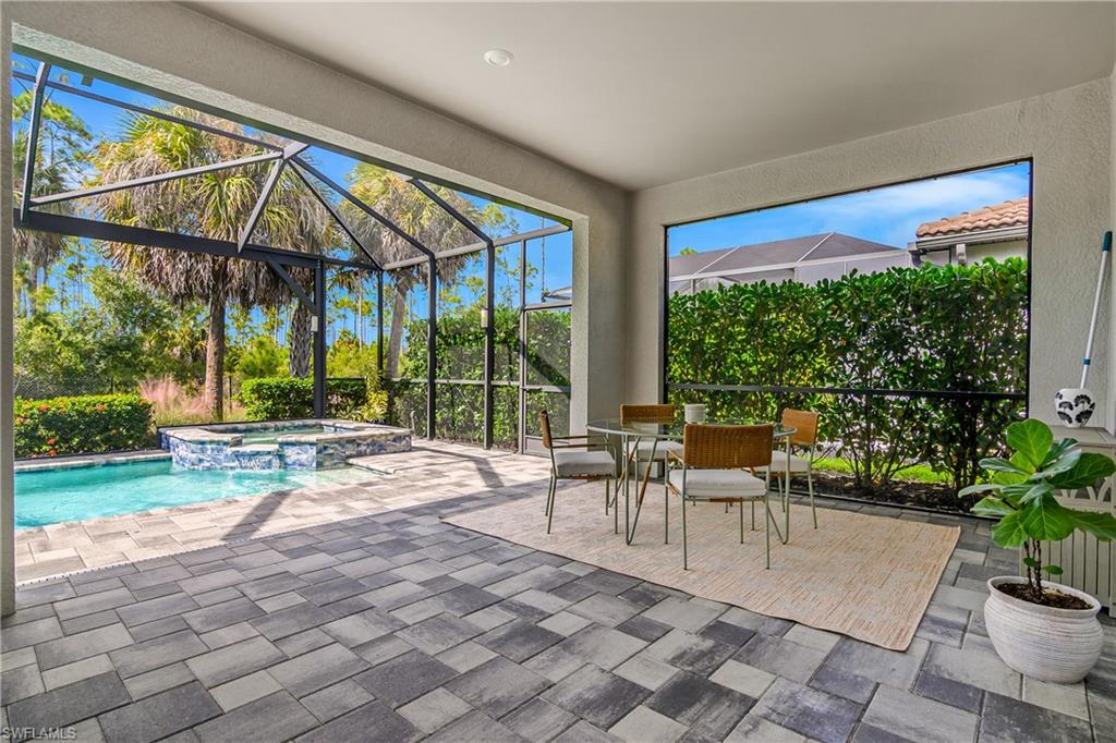 19040 Marquesa Drive Fort Myers, FL 33913 - Photo 35 of 50 Enjoy your morning coffee or any meal al fresco on your spacious screen lanai.