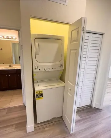 a view of a storage and utility room with a washer dryer