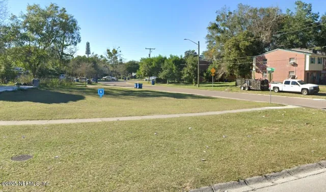a view of a swimming pool and trees