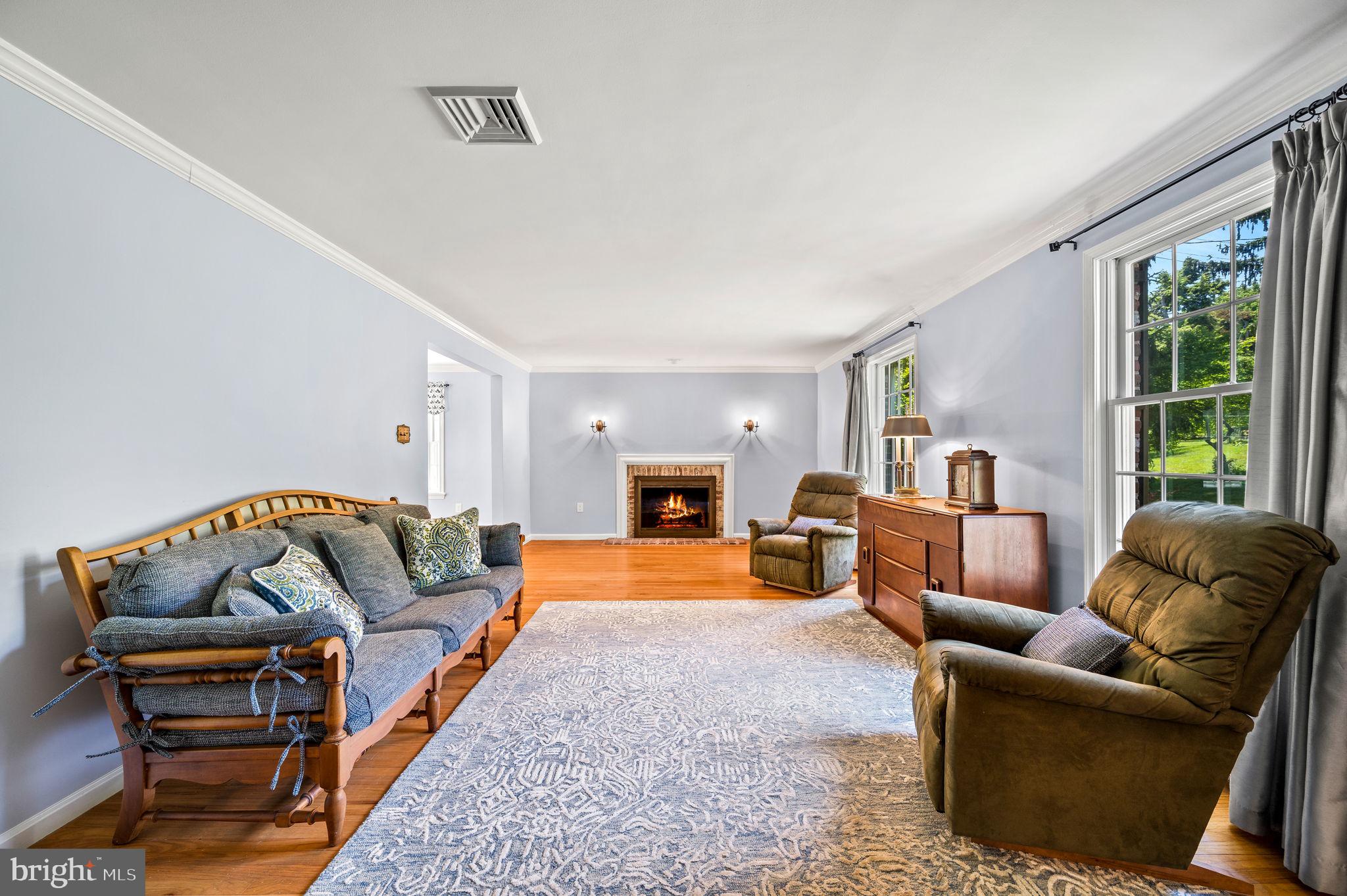 11 Buttonwood Way Rose Valley, PA 19063 - Photo 8 of 65 Living room with wood burning fireplace