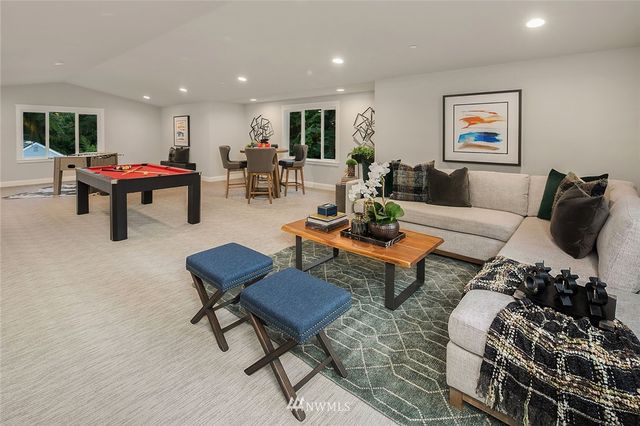 a living room with furniture and a rug