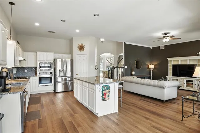 a living room with furniture and flat screen tv