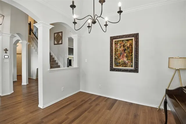 a view of an entryway with wooden floor