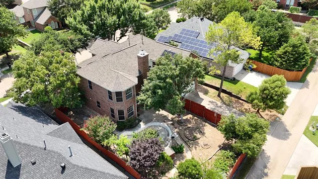 an aerial view of house with yard