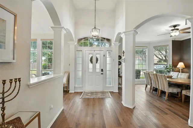 a view of a dining room with furniture window and wooden floor
