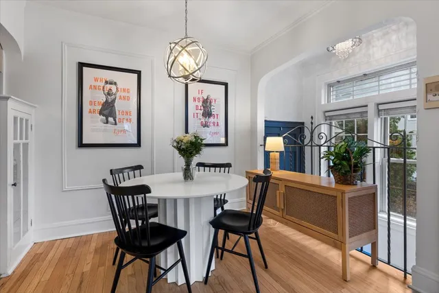 a view of a dining room with furniture and wooden floor