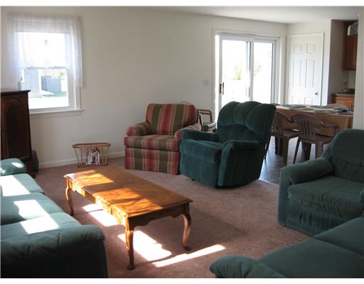 171 Charlestown Beach Road Charlestown, RI 02813 - Photo 10 of 10 Living Room. THE LIVING ROOM OPENS TO THE EAT IN KITCHEN PROVIDING A WONDERFUL OPEN FLOOR PLAN FOR THE LARGER GATHERINGS THAT ARE PART OF LIVING AT THE BEACH.