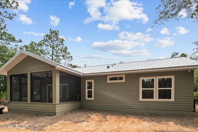 a house with trees in the background