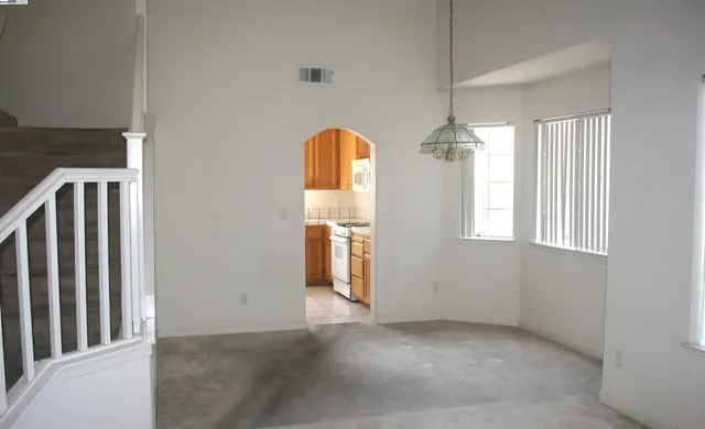 a view of empty room with windows