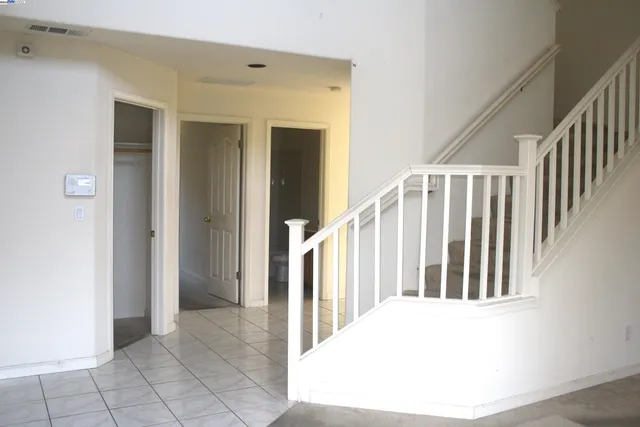 a view of a hallway with staircase