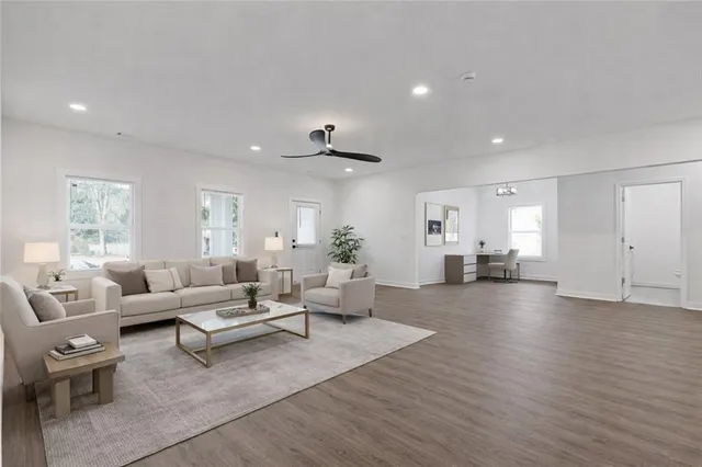 a living room with furniture and a large window