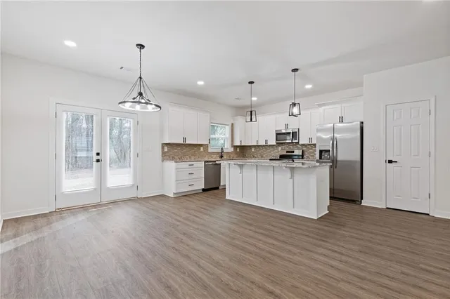 a view of a kitchen with wooden floor