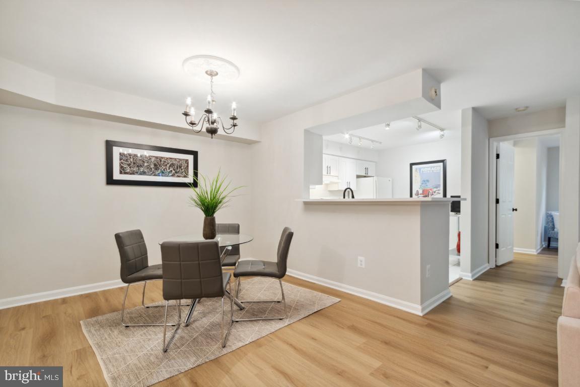 2241 Lovedale Lane, Unit D Reston, VA 20191 - Photo 14 of 31 a view of a dining room with furniture and wooden floor