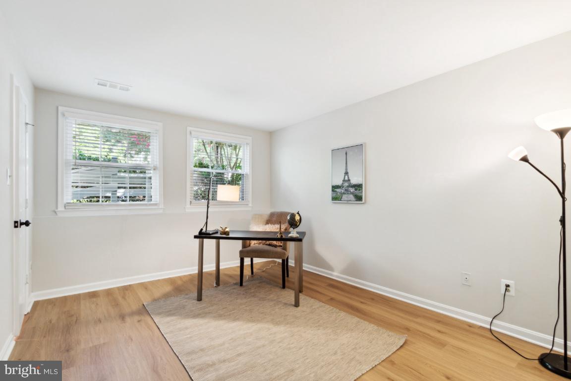 2241 Lovedale Lane, Unit D Reston, VA 20191 - Photo 16 of 31 a workspace room with wooden floor and windows