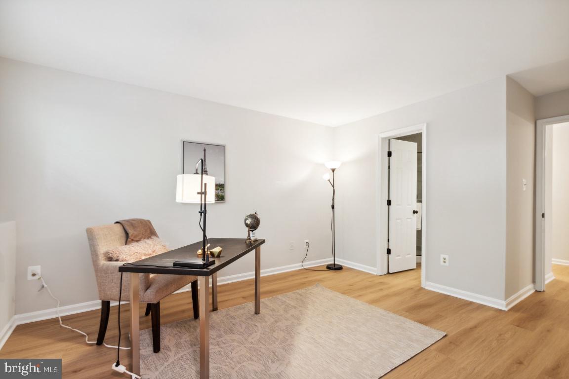 2241 Lovedale Lane, Unit D Reston, VA 20191 - Photo 17 of 31 a workspace with furniture and wooden floor