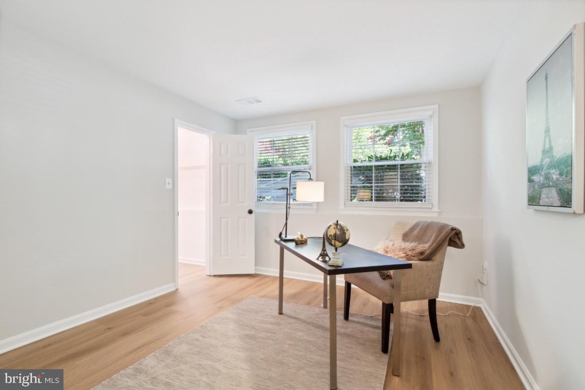 2241 Lovedale Lane, Unit D Reston, VA 20191 - Photo 18 of 31 a view of a workspace with furniture and a window