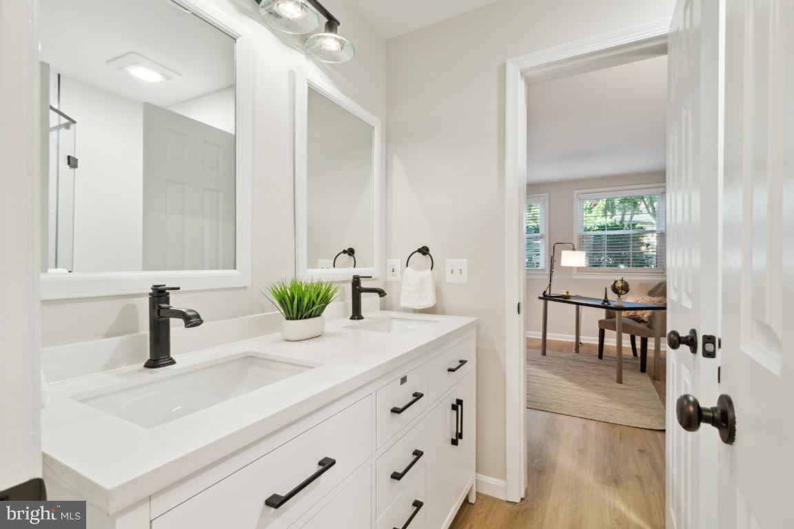 2241 Lovedale Lane, Unit D Reston, VA 20191 - Photo 19 of 31 a bathroom with a sink and a mirror