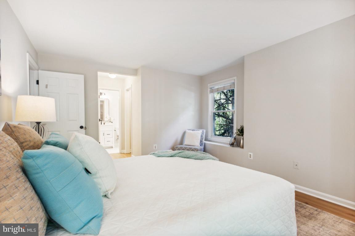2241 Lovedale Lane, Unit D Reston, VA 20191 - Photo 23 of 31 a bedroom with a bed and a window