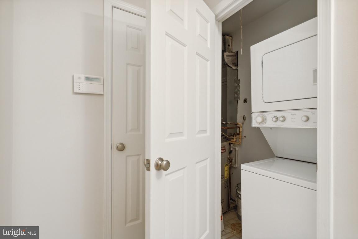 2241 Lovedale Lane, Unit D Reston, VA 20191 - Photo 27 of 31 a utility room with dryer and washer