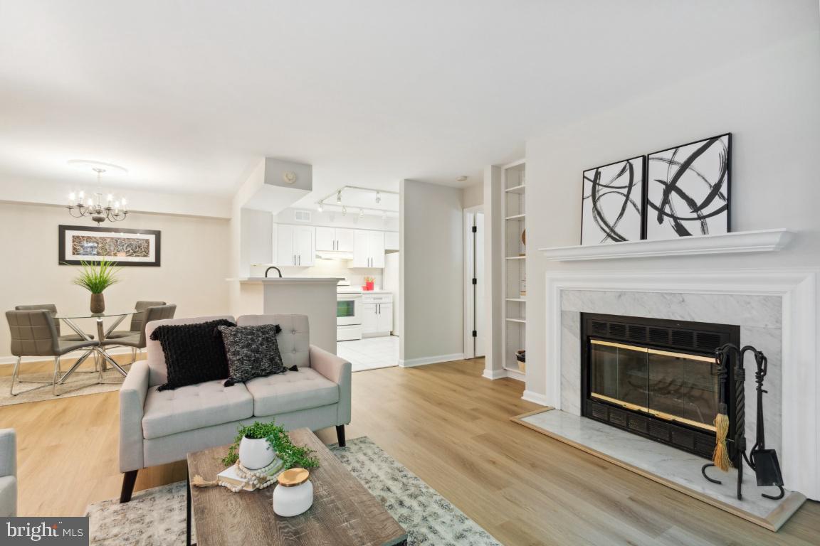 2241 Lovedale Lane, Unit D Reston, VA 20191 - Photo 7 of 31 a living room with furniture and a fireplace