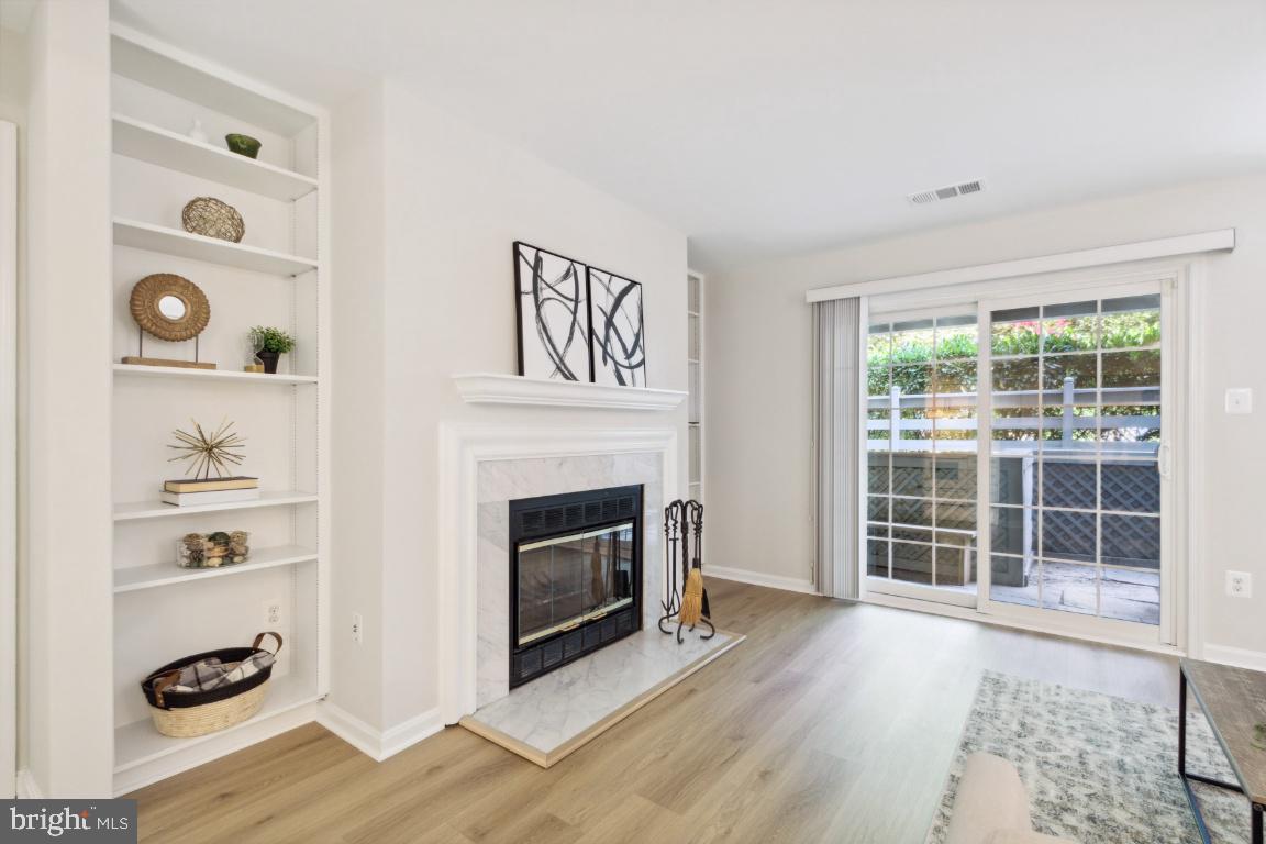 2241 Lovedale Lane, Unit D Reston, VA 20191 - Photo 8 of 31 a view of a livingroom with furniture and a fireplace