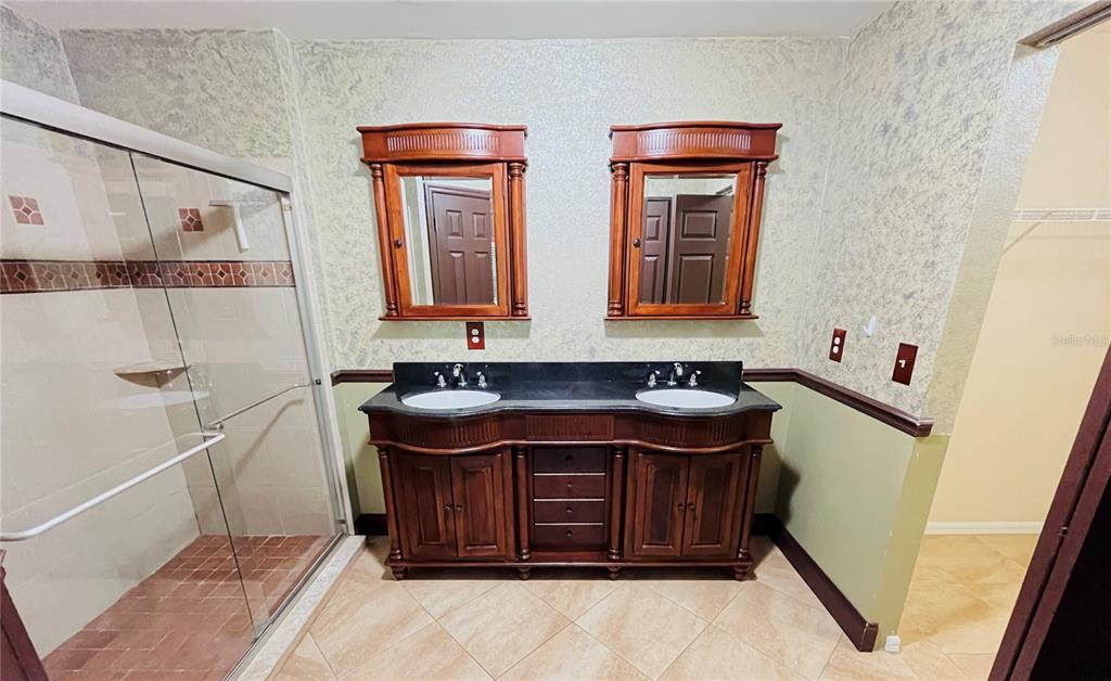 32 Porter Lane Palm Coast, FL 32164 - Photo 18 of 28 a bathroom with a sink and a mirror