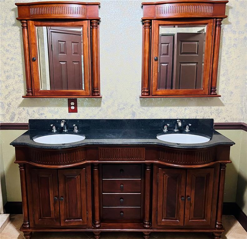 32 Porter Lane Palm Coast, FL 32164 - Photo 19 of 28 a bathroom with a sink and a mirror