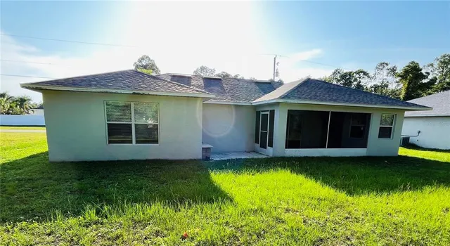 a view of an empty room with a large window