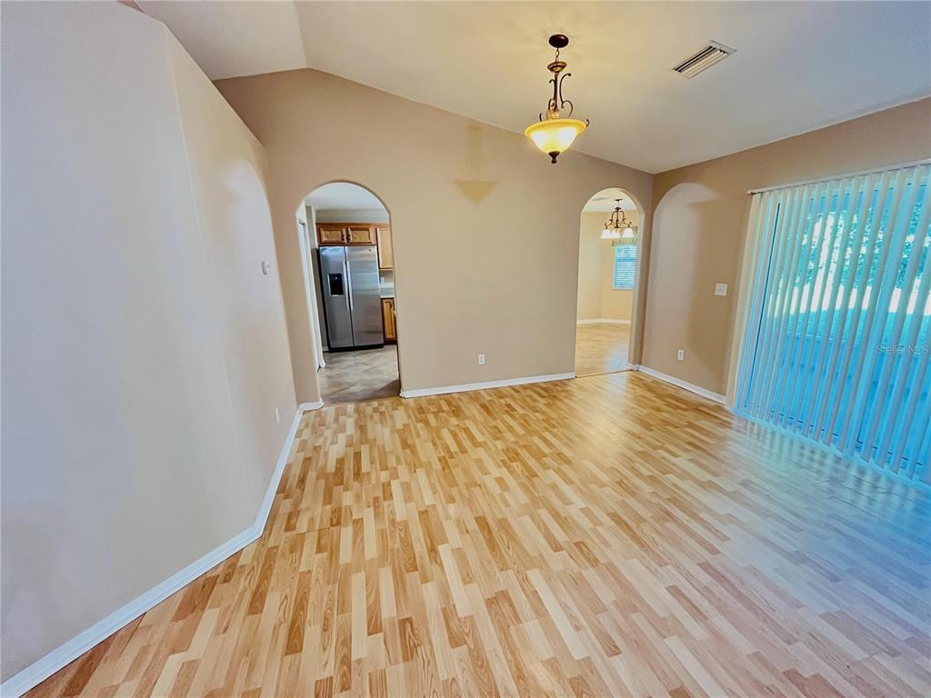 32 Porter Lane Palm Coast, FL 32164 - Photo 5 of 28 a view of a livingroom with wooden floor and staircase