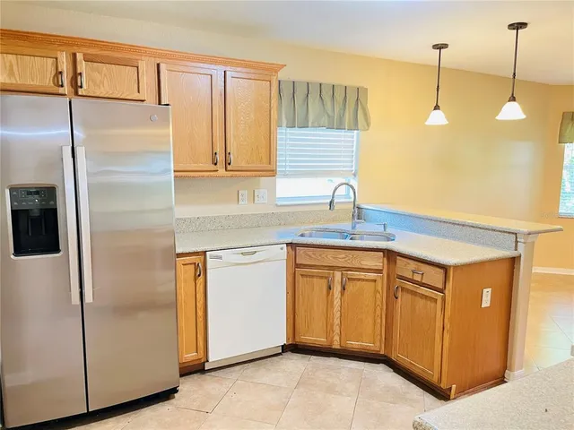 a kitchen with cabinets a sink and appliances