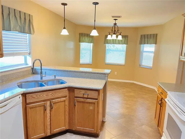 a kitchen with a sink and a window