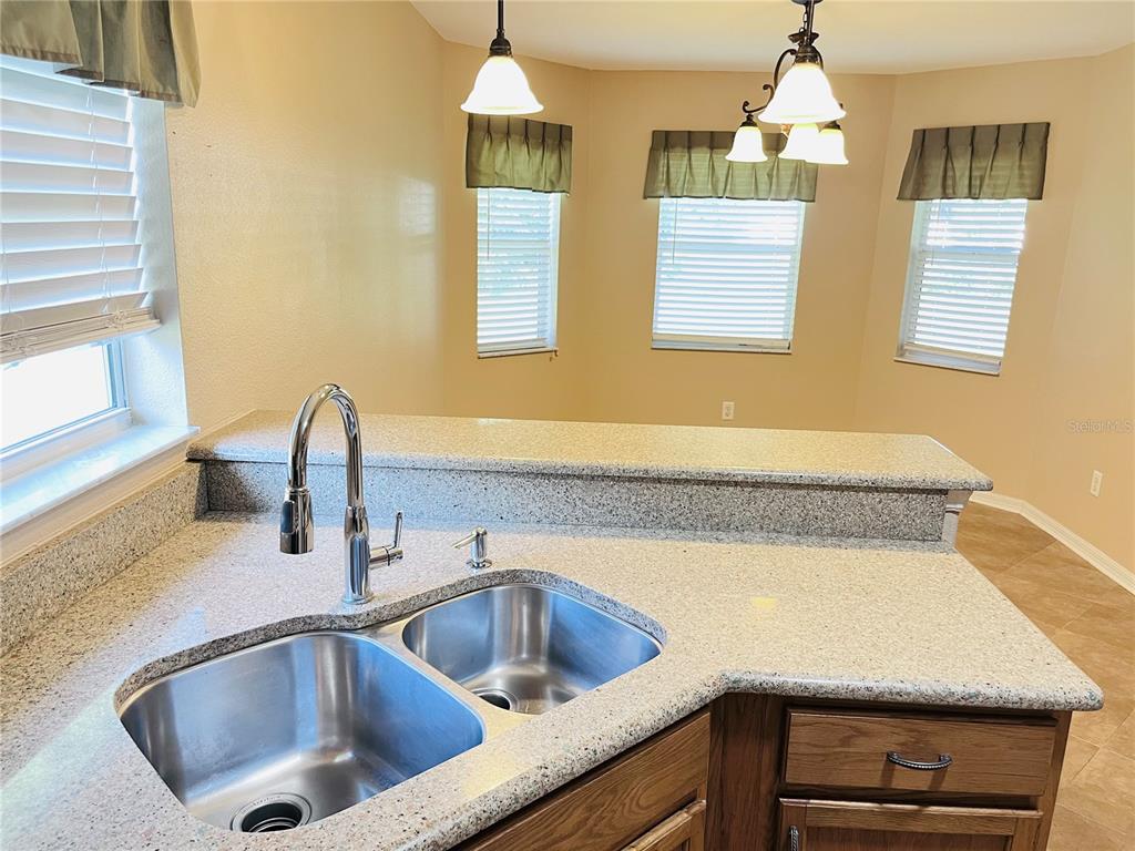 32 Porter Lane Palm Coast, FL 32164 - Photo 10 of 28 a kitchen with a sink and a window