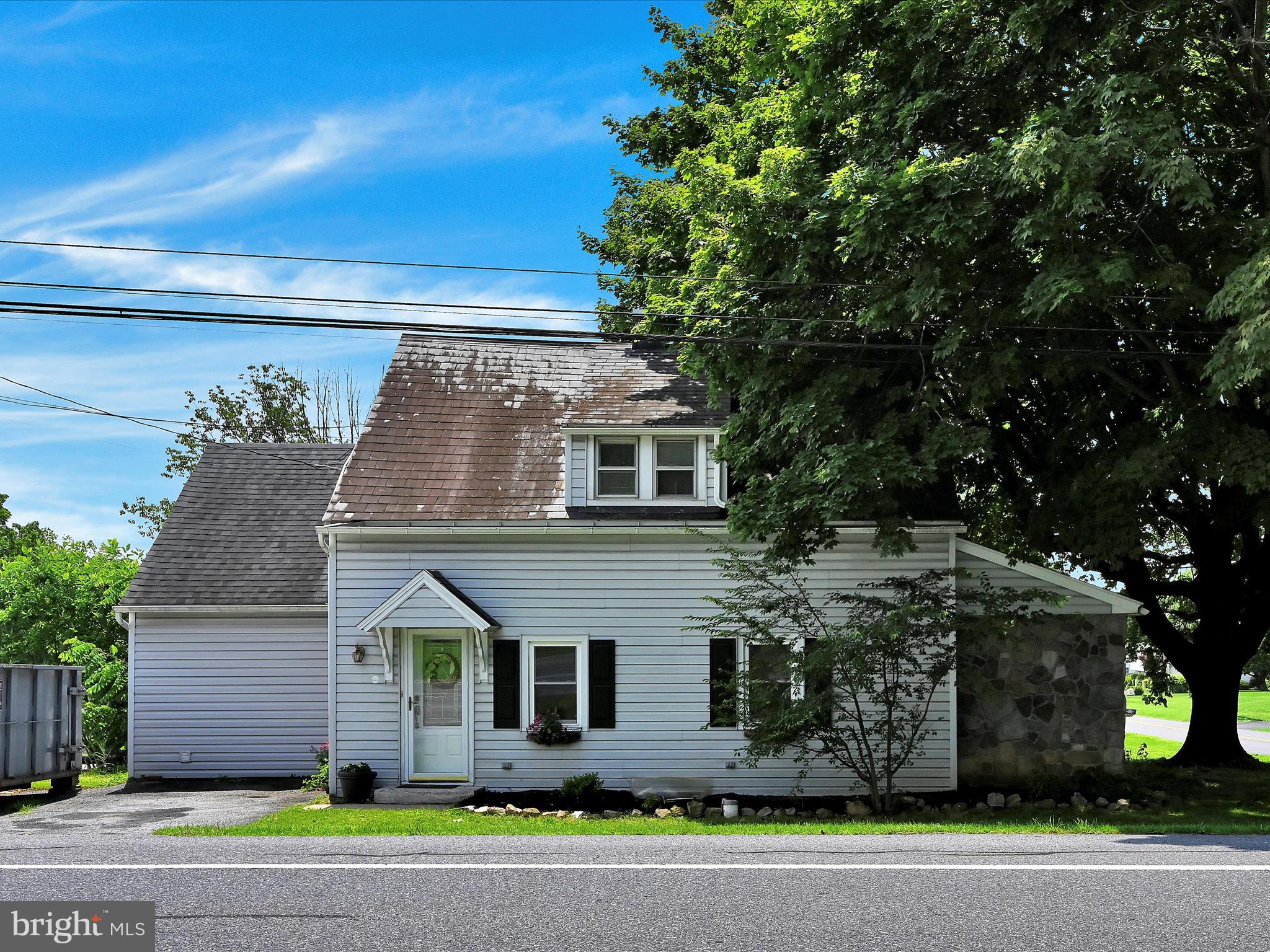 5 Hershey Road Lititz, PA 17543 - Photo 1 of 32 a front view of a house with a yard and garage